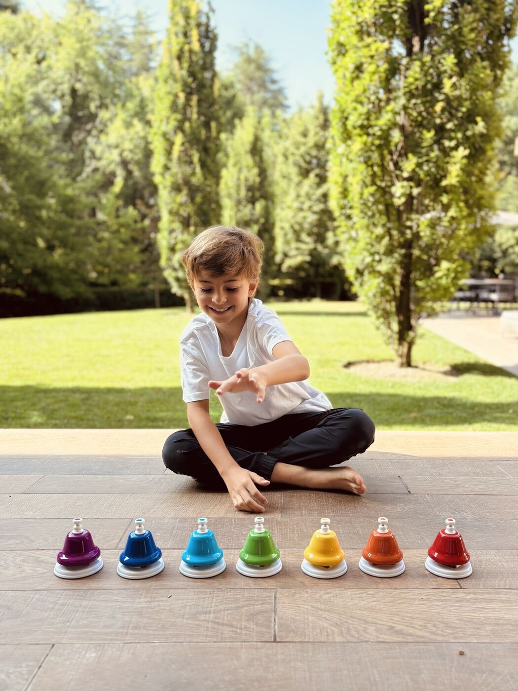 Child playing music bells